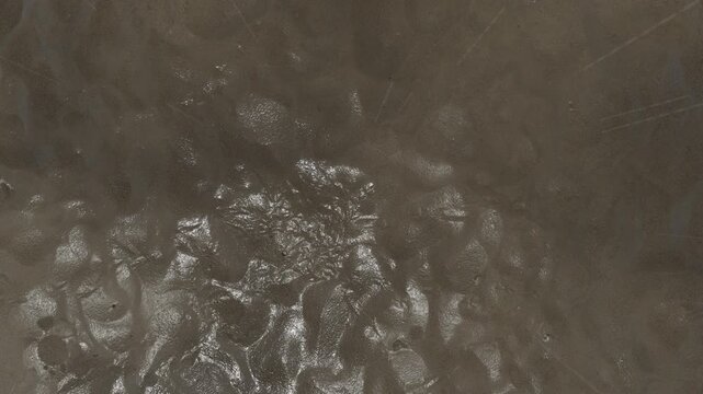 Wet Muddy Ground Surface Organic Texture Loop Motion Graphic Background