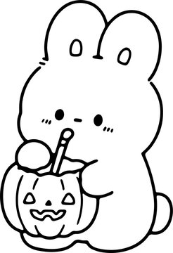 Cute Bunny Enjoying Halloween Pumpkin Treat