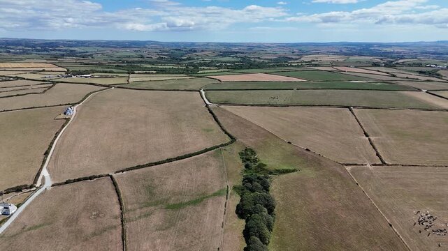 Forward Drone Flight Over Patchwork Farmland and Rural Countryside in Cornwall