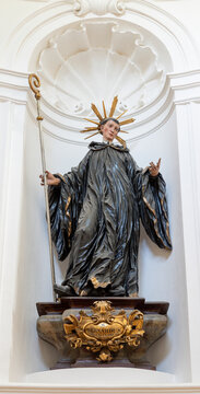 Salzburg - The carved polychrome baroque statue of St. Bernard of Clairvaux in the church Kollegienkirche by Josef Anton Pfaffinger (cca 1719).