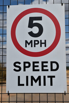 5 MPH Miles Per Hour speed limit sign on fence 
