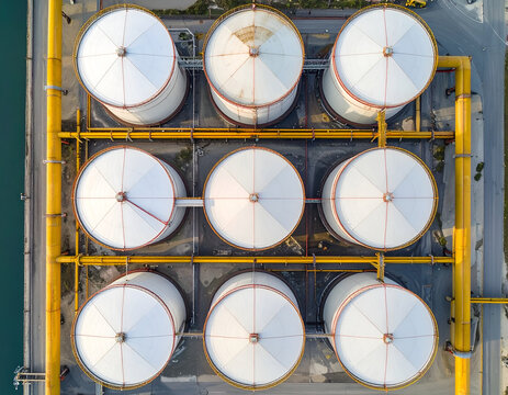 Aerial View of Industrial Oil Storage Tanks Lined Up in Rows.