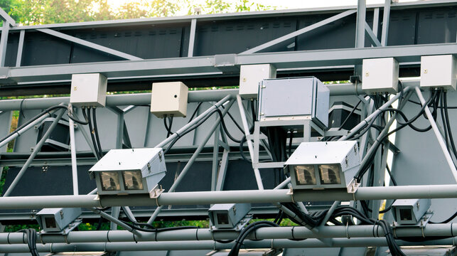 Electronic Road Pricing gantry with smart traffic monitoring equipment above highway. Intelligent transportation technology, automated toll collection and urban mobility infrastructure in Singapore.