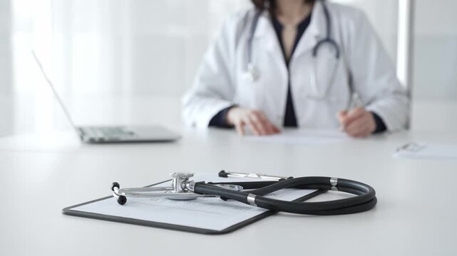 Stethoscope on clipboard, doctor working in office, preparing for patient examination, medical healthcare appointment. Medicine, healthcare and science concept