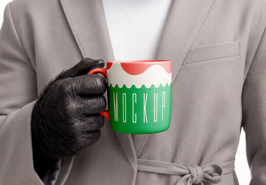Coffee Mug Mockup Held by Surreal Gorilla Hand in Business Suit