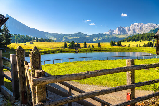 Idyllic lake and Alpine landscape of Seiser Alm height. Alpe di Siusi.