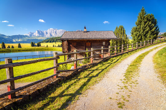 Idyllic lake and Alpine landscape of Seiser Alm height. Alpe di Siusi.