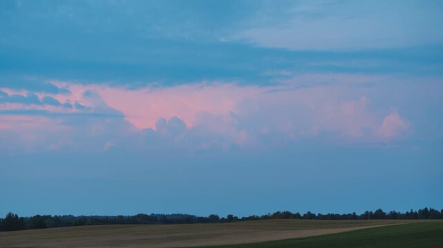 Cumulus storm clouds growing in the night sky
