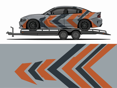 Muscle car on flatbed trailer with geometric wrap design