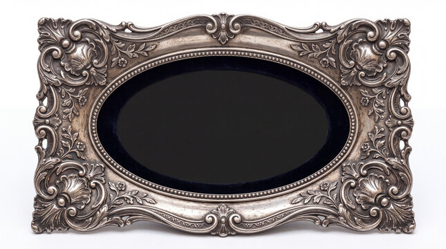 Ornate silver oval picture frame with intricate detailing and a plush black interior