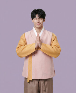 한복을 입고 합장 인사하는 남성 / Man in Hanbok Greeting with Hands Together