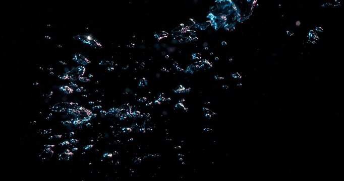 This mesmerizing video showcases vibrant air bubbles rising and dancing in water, perfect for dynamic motion graphics and effects in design projects, adding creativity and inspiration to visuals