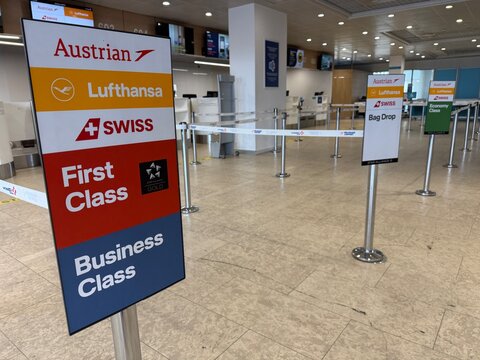 Belgrade, Serbia &ndash; June 25, 2026: Star Alliance check in signage for Austrian Airlines, Lufthansa, SWISS showing First Class and Business Class. Bag Drop lanes at Nikola Tesla Airport terminal hall.