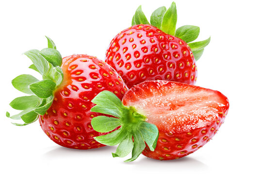 Three ripe juicy strawberries, one cut and two whole, isolated on transparent background.