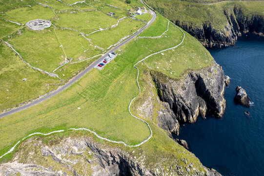 Drone aerial scenery of Dramatic cliffs and fahan beehive huts. Slea head drive wild atlantic ocean way Ireland. Irish landscape