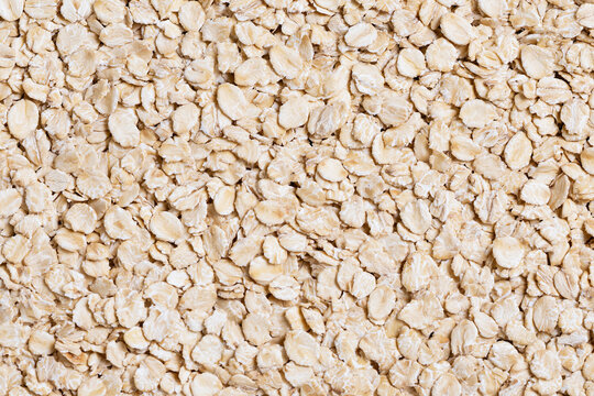 Background Pattern of Raw Dry Rolled Oats Flakes