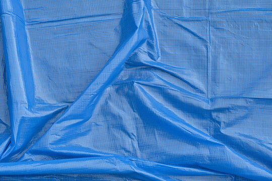 Blue Crumpled Plastic Tarpaulin Sheet Surface Background Texture