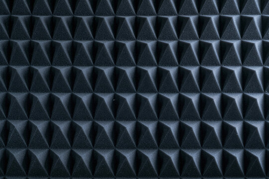 Close up shot of black acoustic foam soundproofing panel background texture