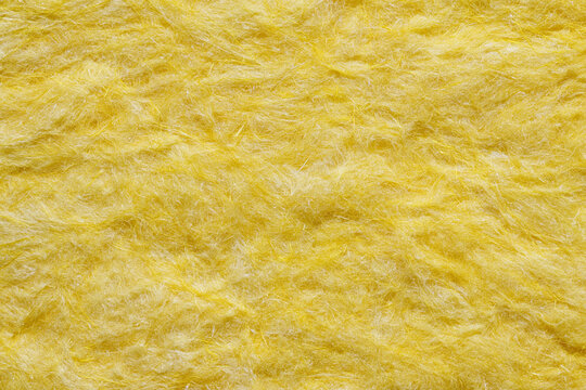 Close Up Yellow Fiberglass Insulation Wool Texture Background