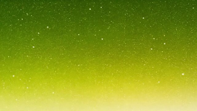 Close-up of a textured green and yellow surface with small white specks