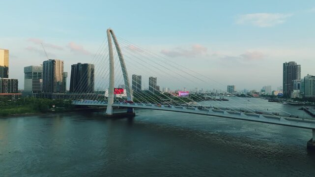 Aerial Shot of Ba Son Bridge Crossing Saigon River in Ho Chi Minh City
Shows evening road traffic commuting across the bridge connecting District 1 with the Thu Thiem urban area against a modern high-
