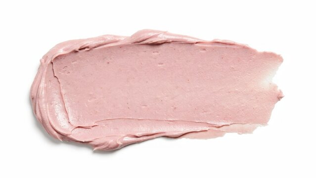 Pale pink creamy cosmetic makeup swatch on white background with cosmetic skincare moisturizer background