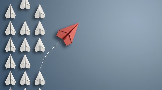Red paper airplane breaks away from white group