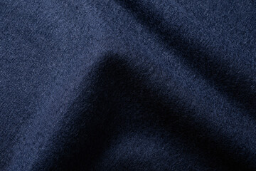 Macro shot of navy blue wool fabric soft surface texture © Clint