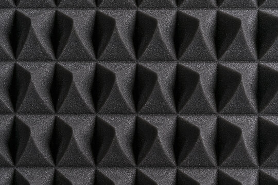Macro view of acoustic foam pyramid panels for studio sound insulation