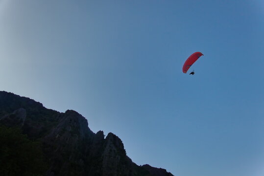 motor paragliding in the blue sky