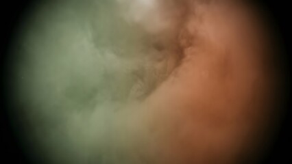 Obraz premium Abstract swirling clouds of green and orange smoke in darkness