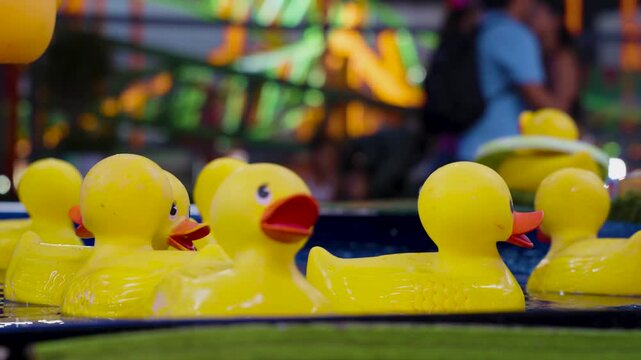 rubber ducks floating in a water carnival game