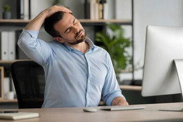 Obraz premium Neck muscle strain and stiffness during stretching at work