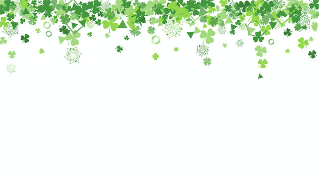 Festive Saint Patrick Day frame of green falling shamrocks and four-leaf clovers over a plain white background.