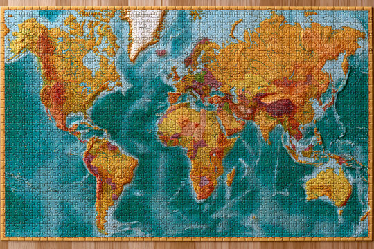 World map puzzle on wooden table surface
