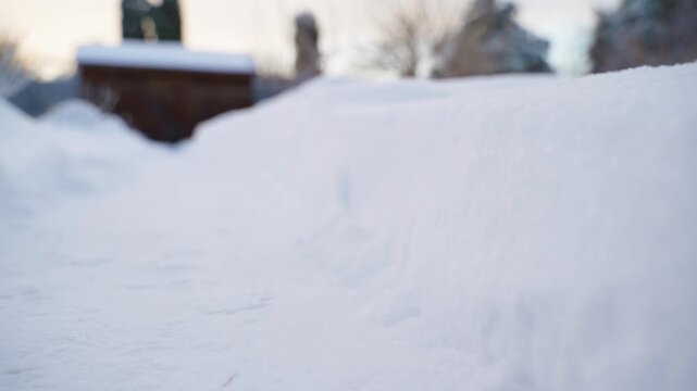 Fresh deep snow drift in yard on winter day close-up