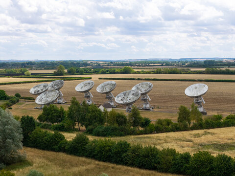 Large Satellite Dish Antennas Stand in the Rural English Countryside During the Day