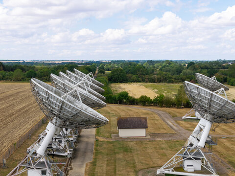Large Radio Telescope Array Antennas Set in the English Countryside During Daylight