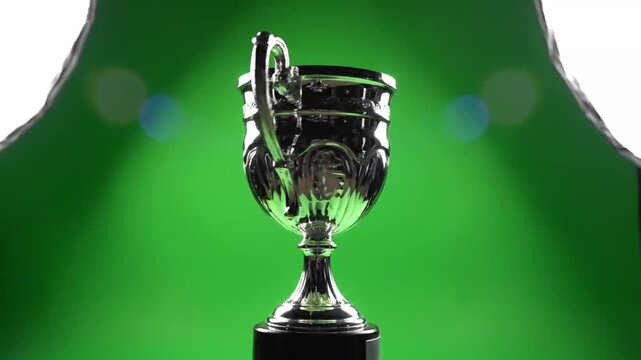 Low-angle trophy with green glowing background