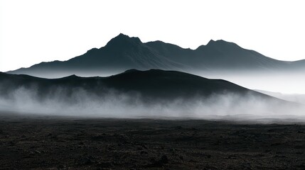 Naklejka premium Dramatic volcanic landscape in iceland with mist and fog covering the dark rocky terrain and mountains in the background