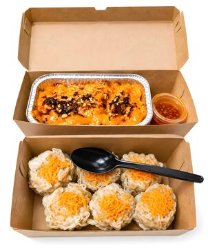 dim sum siomay with carrot toppings and baked mentai in kraft paper takeaway boxes isolated on white background