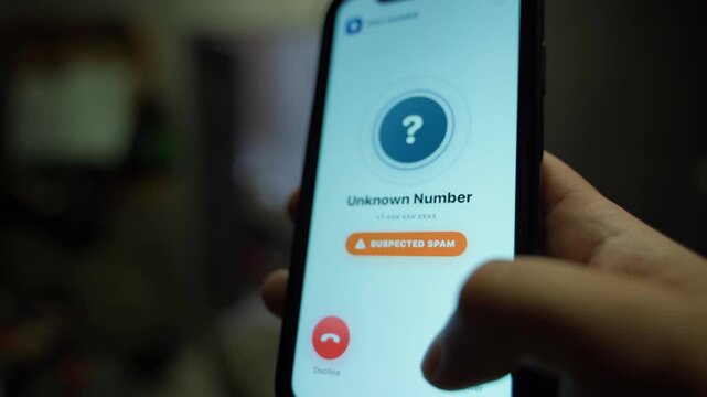 Hand answering call from unknown number on smartphone close-up. Spam calls from hidden numbers