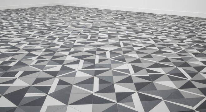 Low angle perspective of intricate grey and white patterned floor tiles provides a stylish and modern foundation for architectural design, stone, space, design