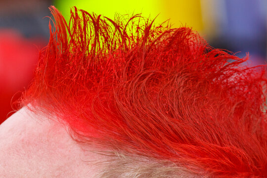Vibrant red mohawk hair style close-up
