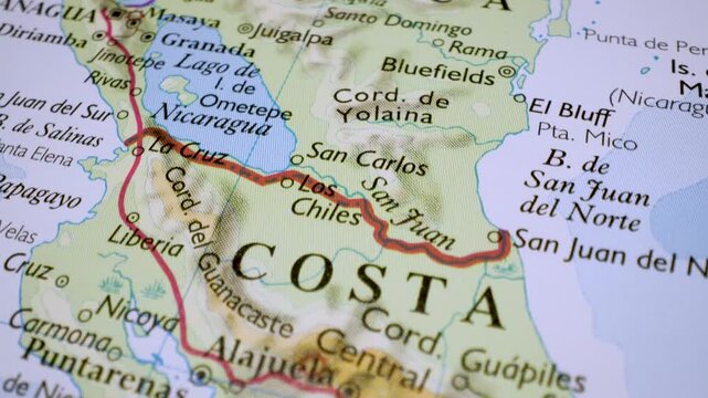 gliding from costa rica to nicaragua over a physical atlas map