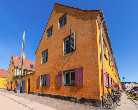 Yellow Historic Building with Bicycles in Copenhagen Denmark
