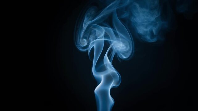 Abstract blue smoke swirling on black background with soft delicate patterns and mysterious atmosphere