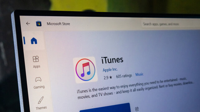 Itunes application page on microsoft store displaying software details and download options on screen.