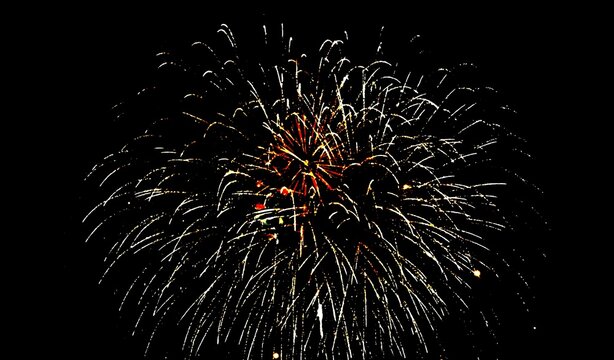 Golden fireworks burst with sparkling trails on dark night background. Perfect for New Year celebrations, festival events, holiday parties, anniversary backdrops, and festive card designs.