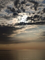 Fototapeta premium Dramatic sunlight breaking through dark clouds over the Black Sea at Golden Sands, Bulgaria.